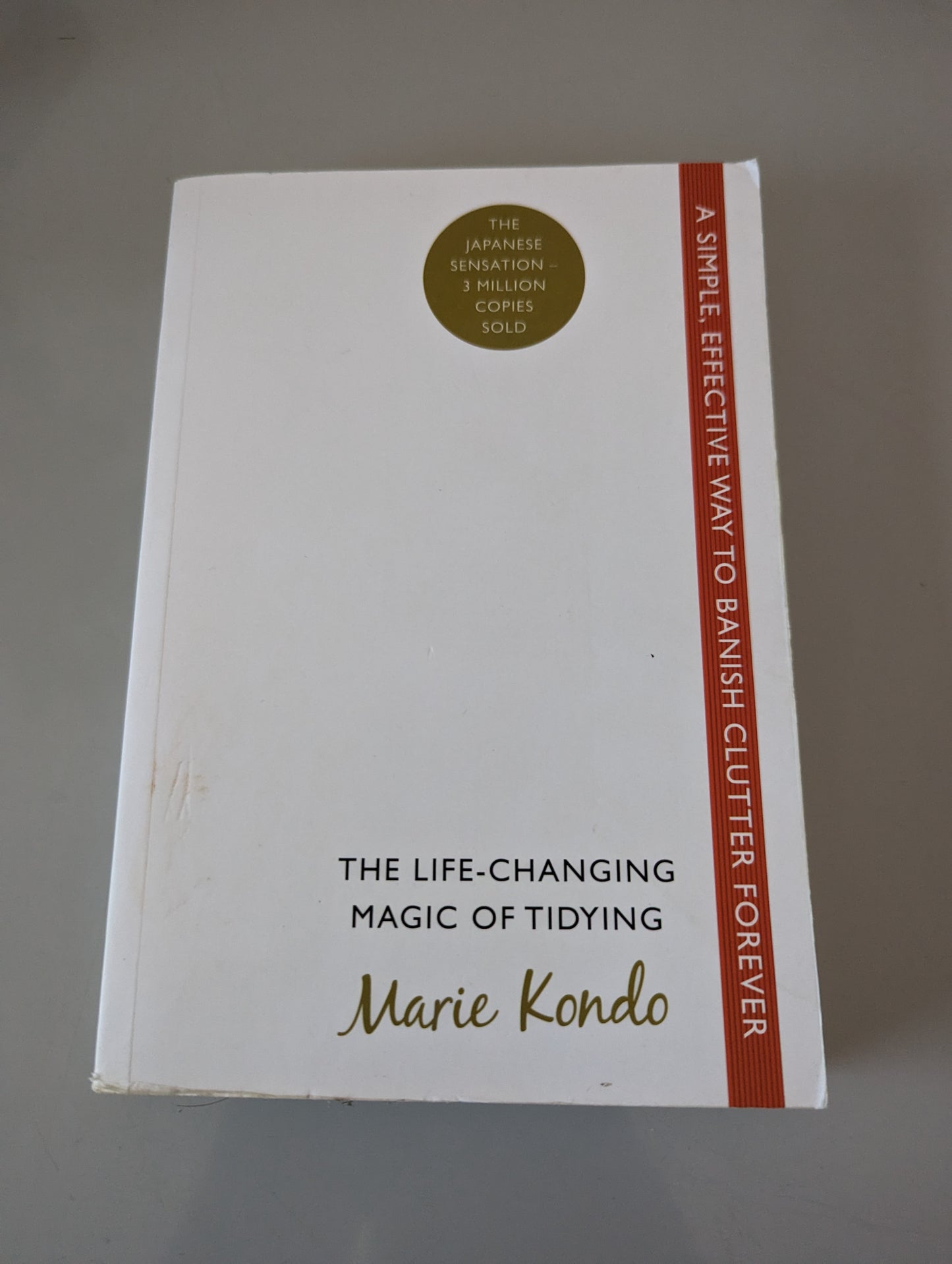 The Life-Changing Magic of Tidying: A simple, effective way to banish clutter forever (Paperback) by Marie Kondo