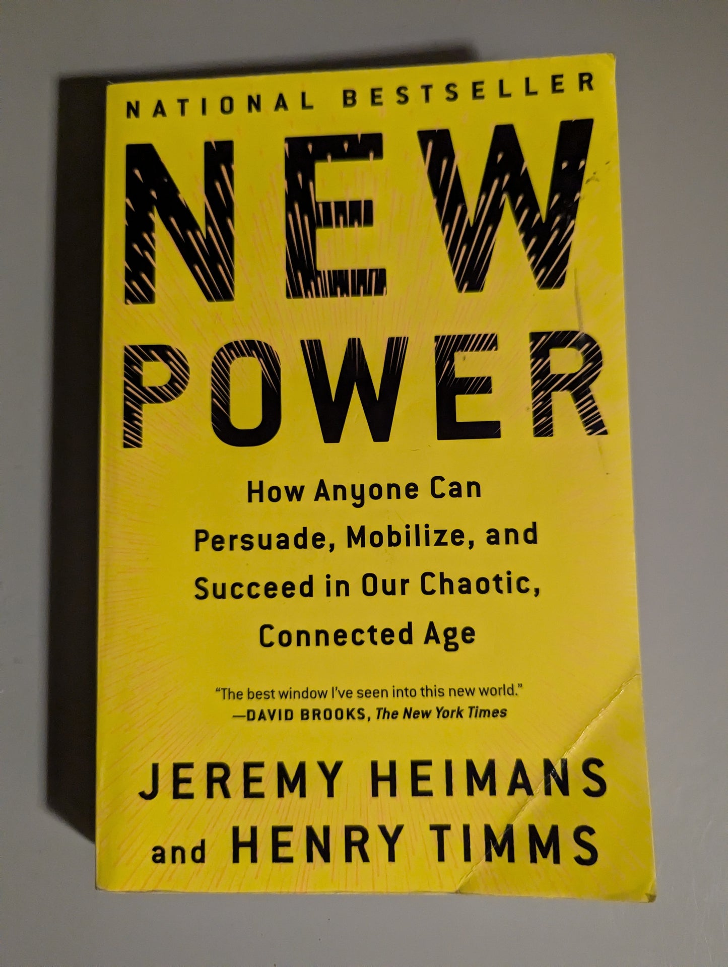 Back cover of New Power by Henry Timms and Jeremy Heimans, showcasing the book's synopsis and secondhand condition, available at PrelovedLibrary.co.uk