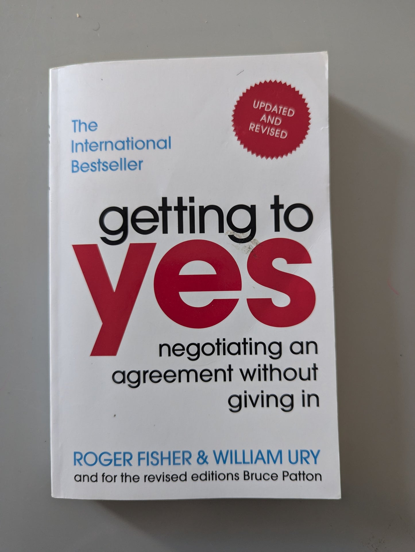 Getting to Yes: Negotiating an agreement without giving in (Paperback) by Roger Fisher