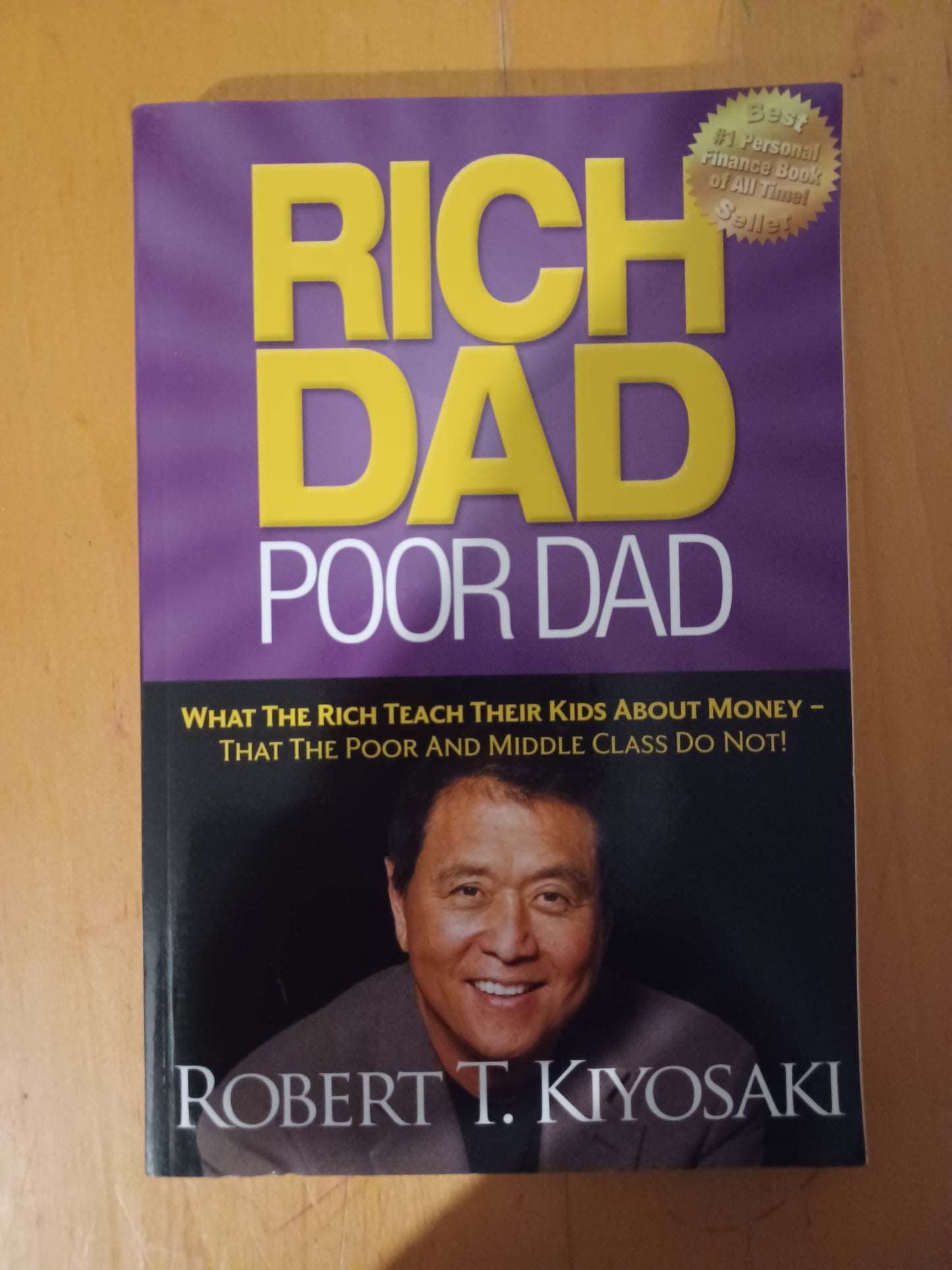 Rich Dad Poor Dad: What the Rich Teach Their Kids About Money That the Poor and Middle Class Do Not! (Paperback) by Robert T. Kiyosaki